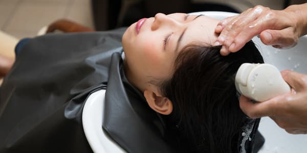 woman geting her hair washed