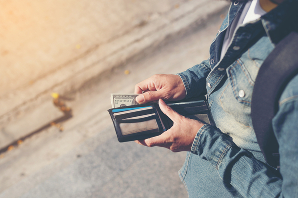 Person looking at open wallet