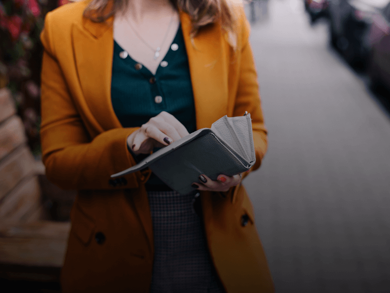 person holding wallet
