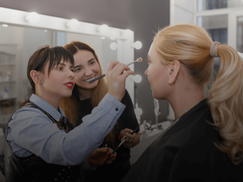 cosmetology teacher instructing student