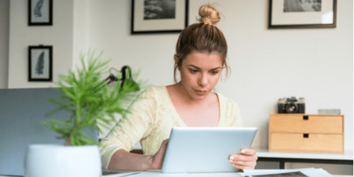 woman working on tablet computer