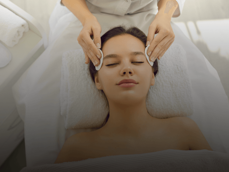 esthetician performing facial services