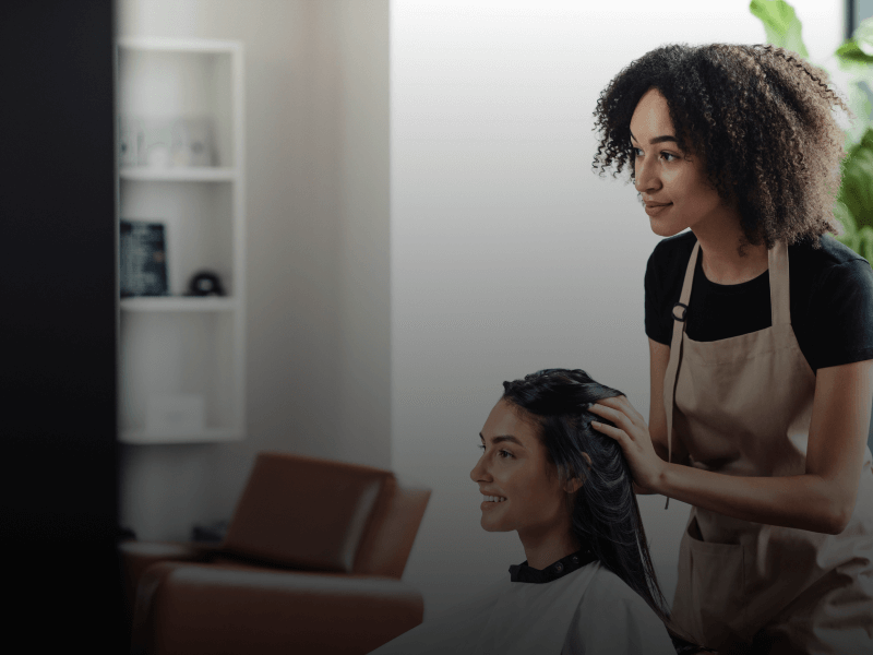 hair dresser cutting client's hair